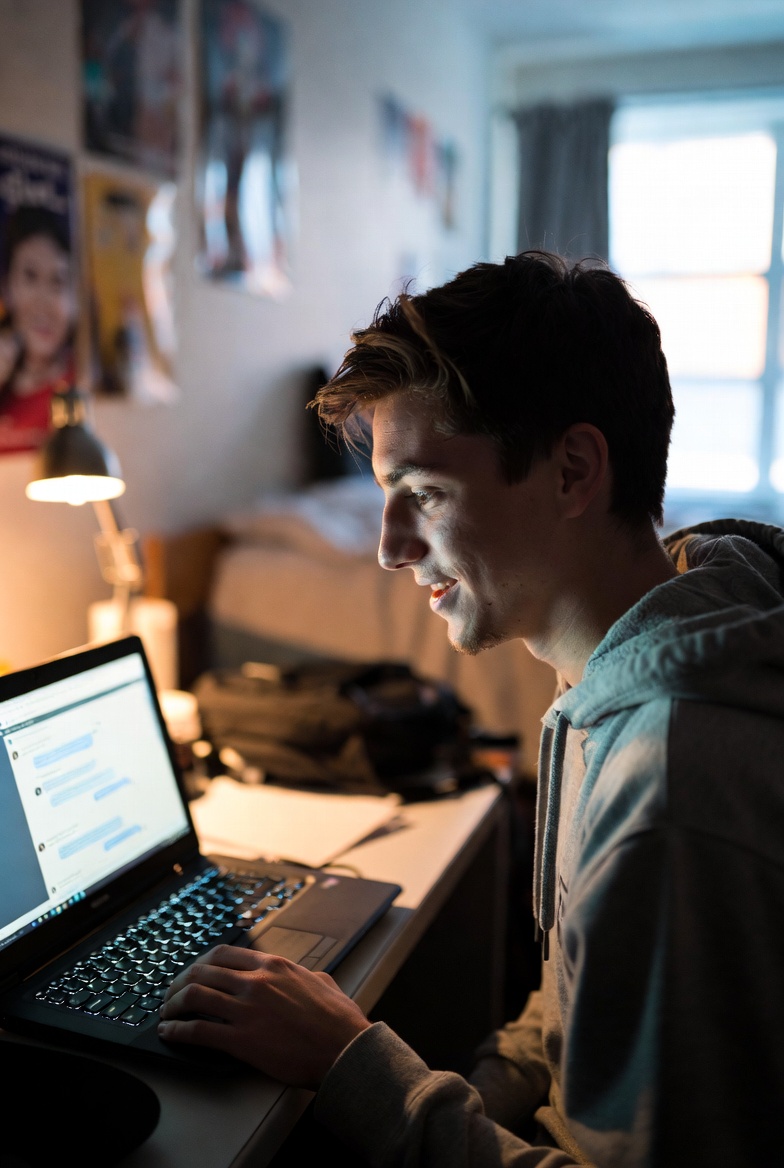 A student engaging an AI mentor inside the Crucibl runtime, showing a conversational interface on a laptop